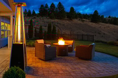 Fire pit with patio heater warming outdoor deck