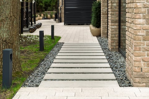 Modern walkway with decorative gravel and brick