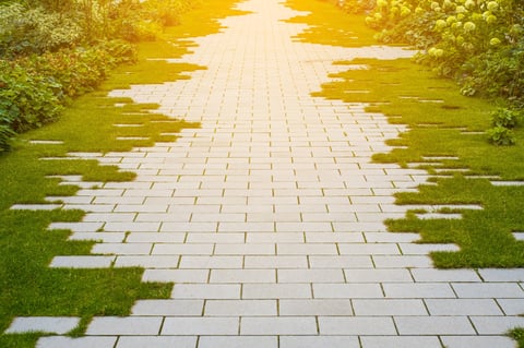 Stone walkway with grass and cobblestones